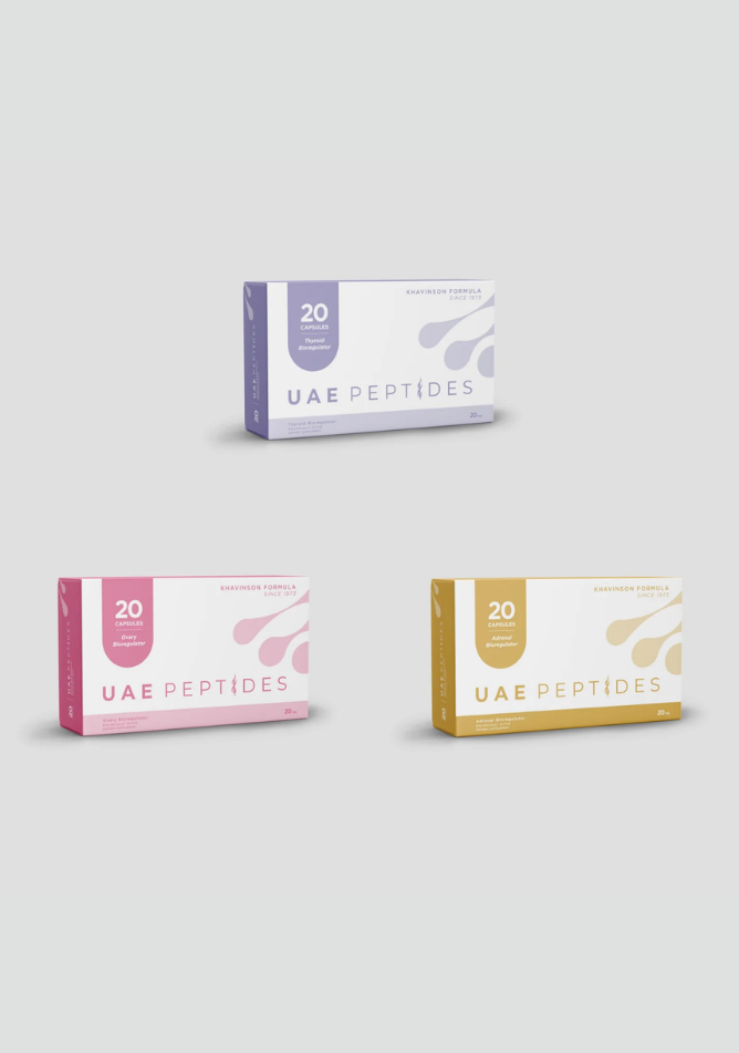 Front image of three boxes of Dnhealth peptide supplements are displayed against a light grey background. The top box is white and lavender and is labelled as a Thyroid bioregulator. The bottom left box is white and pink and is labelled as an Ovary bioregulator. The bottom right box is white and gold and is labelled as an Adrenal bioregulator.