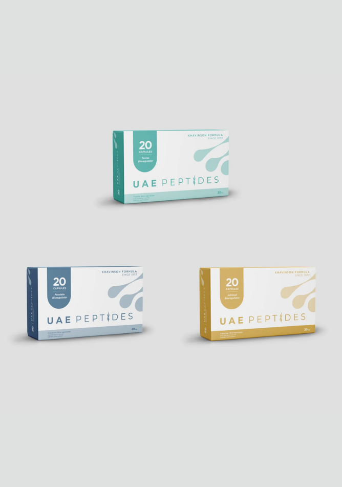Front image of three boxes of Dnhealth peptide supplements are displayed against a light grey background. The top box is white and green and is labelled as a Testes Bioregulator. The bottom left box is white and gold and is labelled as an Adrenal Bioregulator. The bottom right box is white and dark blue and is labelled as an Prostate Bioregulator.