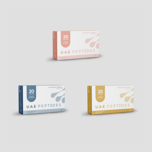 Front image of three boxes of Dnhealth peptide supplements are displayed against a light grey background. The top box is white and pink and is labelled as an Cartilage Bioregulator. The bottom right box is white and dark blue and is labelled as an Prostate Bioregulator. The bottom left box is white and gold and is labelled as an Adrenal Bioregulator.